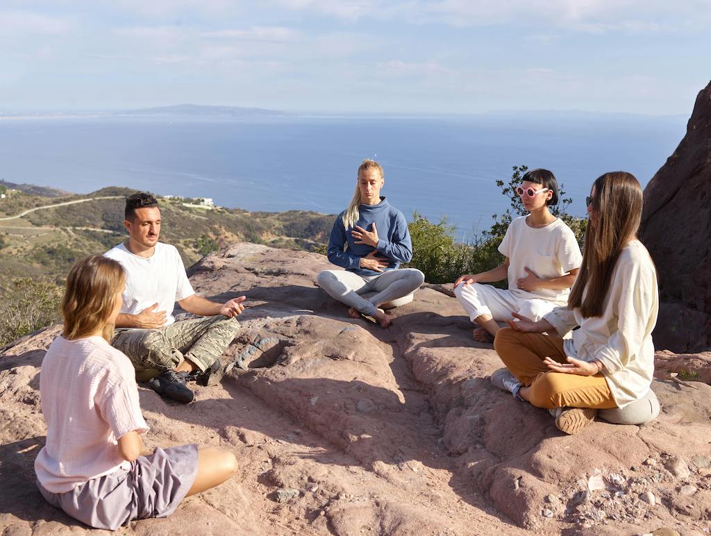 Group meditation during wellness retreat in Mexico