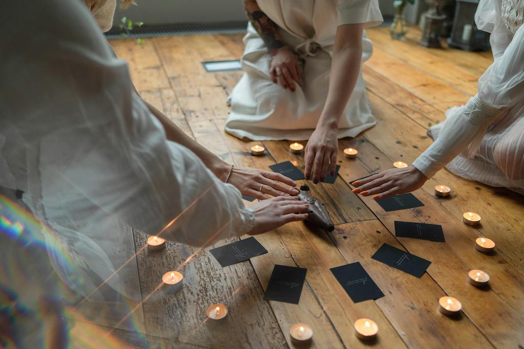A small wellness group gathered in a moonlit space for a breathwork session