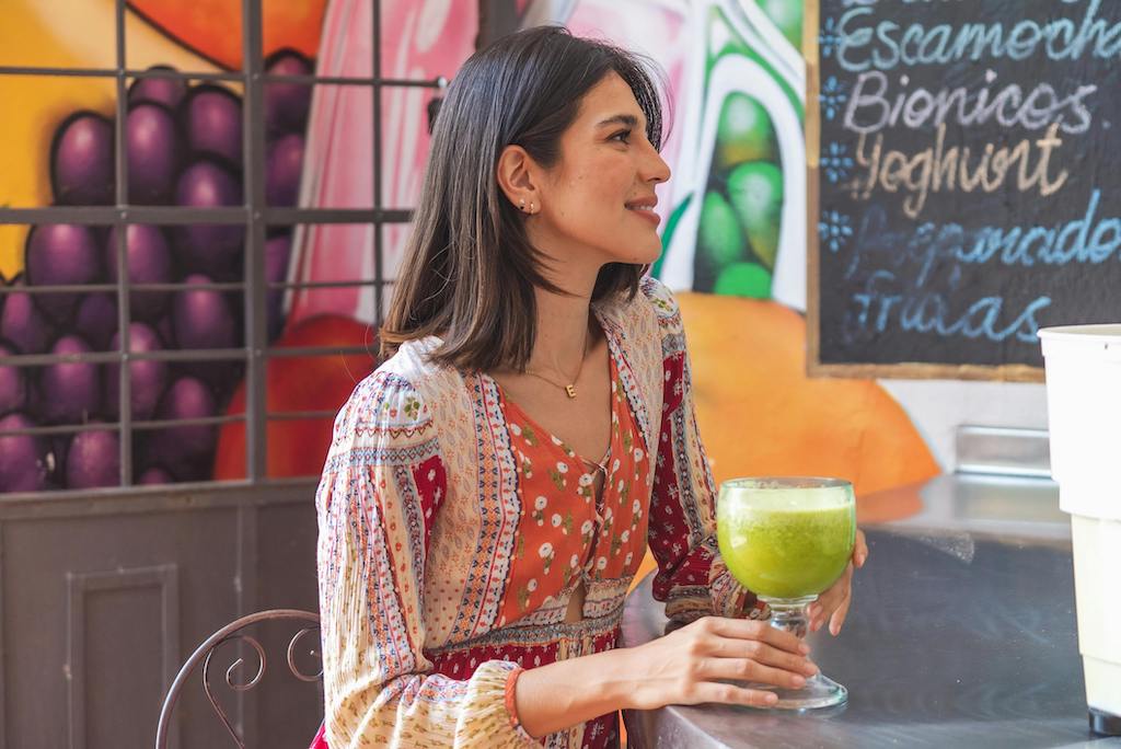 Person resting and drinking agua fresca.